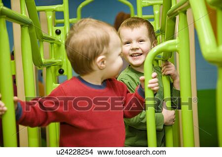 Children playing View Large Photo Image Picture - Children playing. Fotosearch