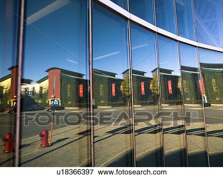 Stock Photo - City scene reflected in windows, The Forks, Winnipeg, Manitoba, Canada. Fotosearch