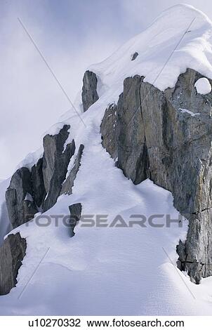 Cliff in the snow View Large Photo Image Stock Image - Cliff in the snow. Fotosearch