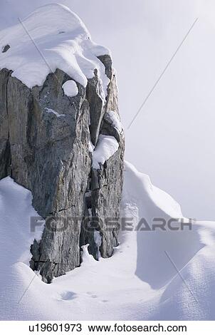 Cliff in the snow View Large Photo Image Stock Image - Cliff in the snow. Fotosearch
