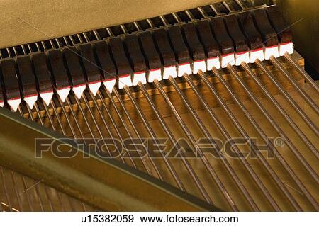 Stock Photo - Close up of piano strings. Fotosearch