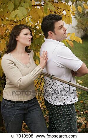 Stock Photo - Couple with man resisting reconciliation. Fotosearch