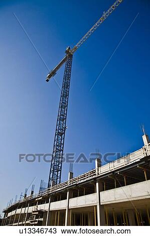 Stock Image - Crane for construction on a building. Fotosearch