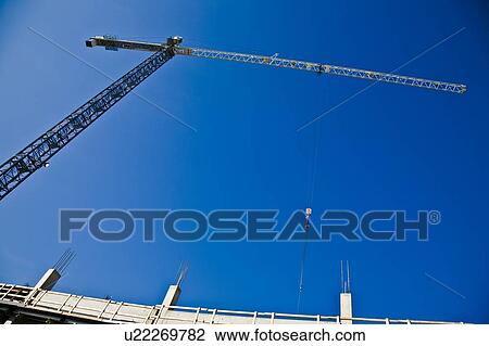 Crane for construction on a building View Large Photo Image Stock Image - Crane for construction on a building. Fotosearch