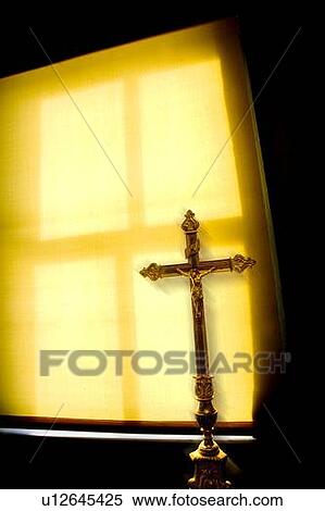 Crucifix next to a window View Large Photo Image Stock Photography - Crucifix next to a window. Fotosearch