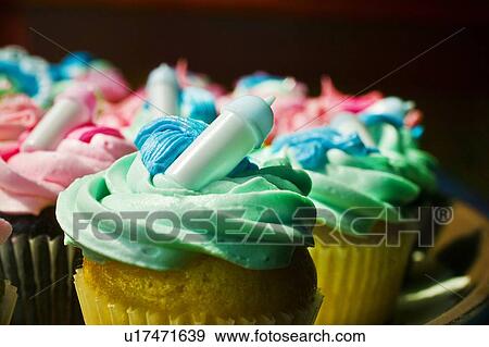Cupcakes celebrating newborn baby View Large Photo Image Stock Photo - Cupcakes celebrating newborn baby. Fotosearch