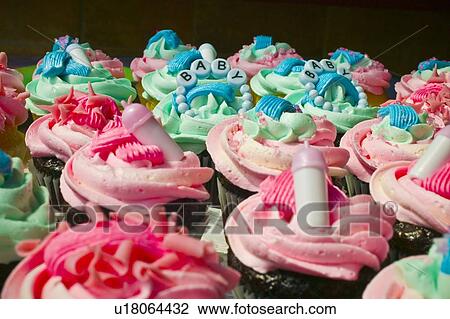 Stock Image - Cupcakes made for a new baby celebration. Fotosearch