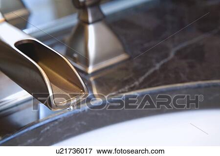 Dripping bathroom faucet View Large Photo Image Stock Photo - Dripping bathroom faucet. Fotosearch