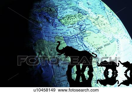 Elephant silhouettes in front of a globe View Large Photo Image Stock Photo - Elephant silhouettes in front of a globe. Fotosearch