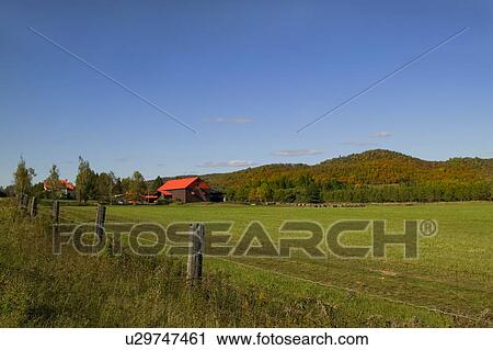 Stock Image - Farm near Mont Tremblant, Quebec, Canada . Fotosearch