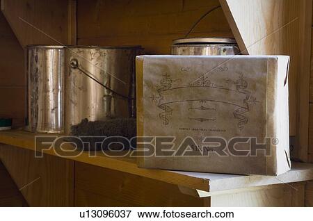 Stock Photo - Fort Edmonton, Alberta, Canada, old paint cans and box of shellac. Fotosearch