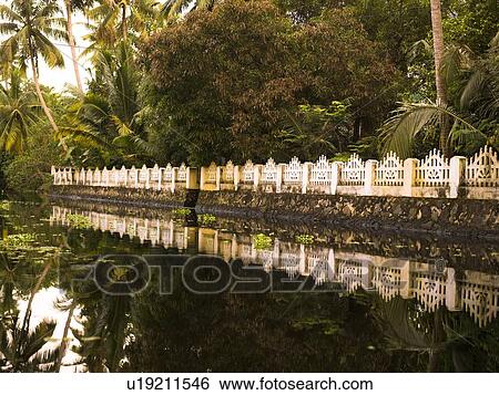 Gate along the water, Kerala, India View Large Photo Image Stock Photograph - Gate along the water, Kerala, India. Fotosearch