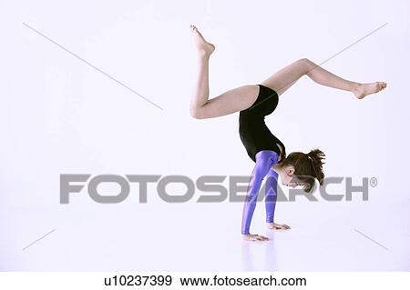 Girl doing gymnastics View Large Photo Image Stock Photo - Girl doing gymnastics. Fotosearch