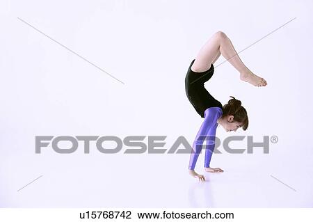 Girl doing handstand View Large Photo Image Stock Image - Girl doing handstand. Fotosearch