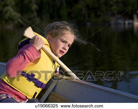 Stock Photography - Girl in a boat. Fotosearch