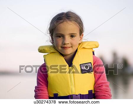 Girl in a personal floatation device View Large Photo Image Stock Photo - Girl in a personal floatation device. Fotosearch