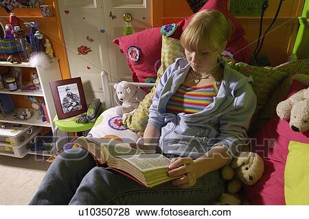 Girl reading Bible in bedroom View Large Photo Image Stock Photo - Girl reading Bible in bedroom. Fotosearch