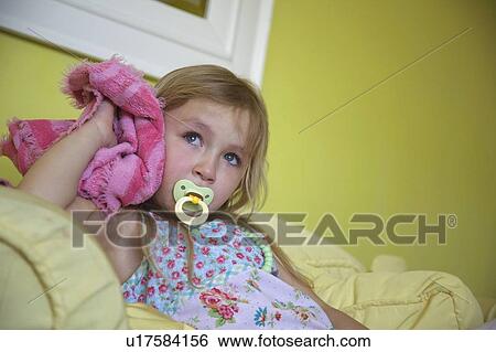 Girl with soother and blanket View Large Photo Image Stock Photograph - Girl with soother and blanket. Fotosearch