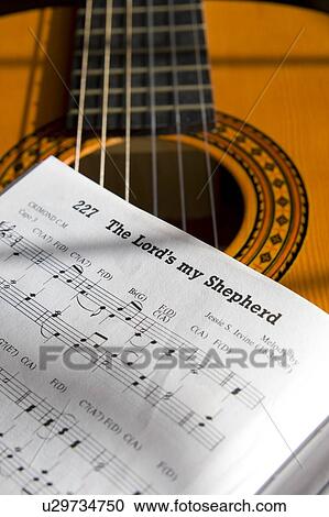 Guitar and book of music View Large Photo Image Stock Image - Guitar and book of music. Fotosearch