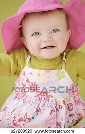 Happy baby girl in pink hat View Large Photo Image Stock Image - Happy baby girl in pink hat. Fotosearch