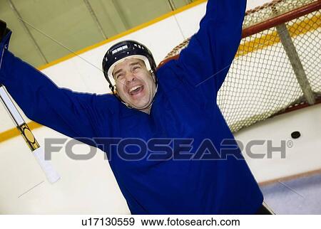 Stock Photo - Hockey player celebrating a goal. Fotosearch