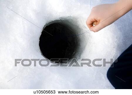 Stock Image - Ice fishing. Fotosearch