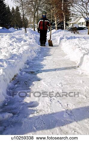 Kid shovelling View Large Photo Image Stock Photo - Kid shovelling. Fotosearch