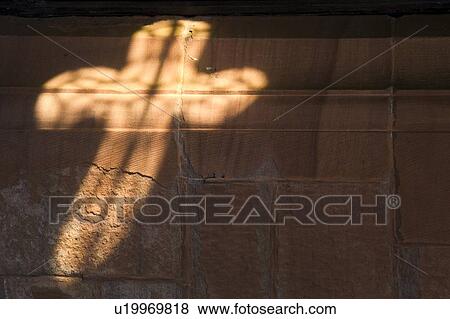 Light in cross shape on wall View Large Photo Image Stock Photo - Light in cross shape on wall. Fotosearch