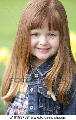 Stock Photo - Little girl in a jean jacket. Fotosearch