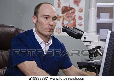 Man and microscope View Large Photo Image Stock Photo - Man and microscope. Fotosearch
