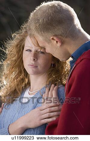 Stock Image - Man comforting a woman. Fotosearch
