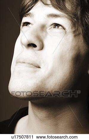 Man looking upwards View Large Photo Image Stock Image - Man looking upwards. Fotosearch