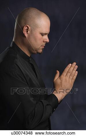 Stock Photo - Man Praying. Fotosearch