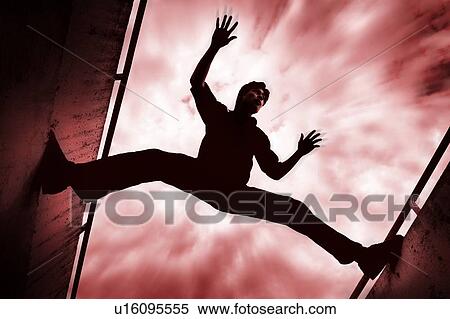 Man stretching between two walls View Large Photo Image Stock Photography - Man stretching between two walls. Fotosearch