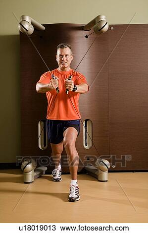 Stock Image - Man working out. Fotosearch
