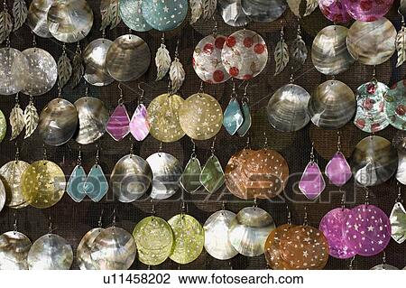 Stock Image - Many pairs of earrings. Fotosearch