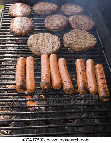 Meat on a barbecue View Large Photo Image Stock Image - Meat on a barbecue . Fotosearch