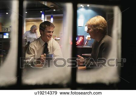 Stock Photo - Men having a conversation. Fotosearch