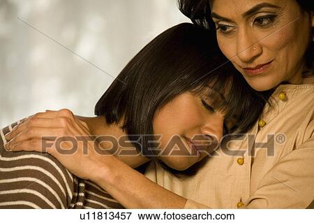 Mother and daughter hugging View Large Photo Image Stock Photo - Mother and daughter hugging. Fotosearch