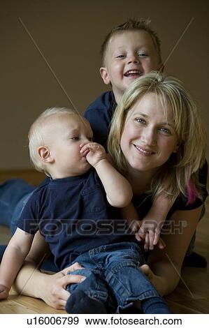 Stock Photo - Mother and two sons. Fotosearch