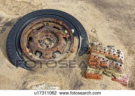 Old tire in the sand View Large Photo Image Stock Image - Old tire in the sand. Fotosearch
