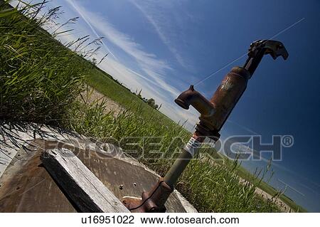 Old water pump at a well View Large Photo Image Stock Image - Old water pump at a well. Fotosearch