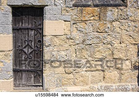 Ornate door, stone wall View Large Photo Image Picture - Ornate door, stone wall. Fotosearch