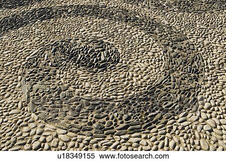 Stock Photography - Pattern made of stones in pavement. Fotosearch