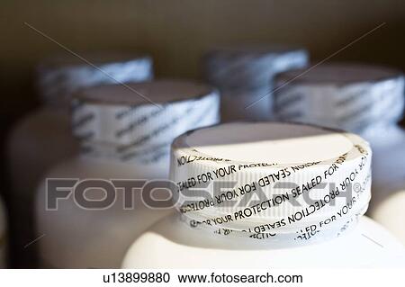 Stock Image - Pill bottle lids. Fotosearch