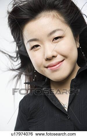 Portrait of a woman smiling View Large Photo Image Stock Photograph - Portrait of a woman smiling. Fotosearch