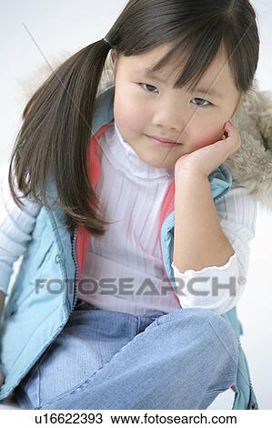 Portrait of a young girl View Large Photo Image Stock Image - Portrait of a young girl. Fotosearch