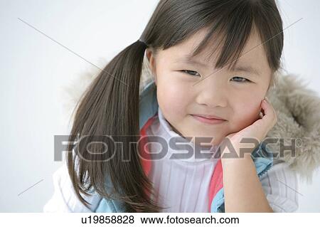 Portrait of a young girl View Large Photo Image Stock Photo - Portrait of a young girl. Fotosearch