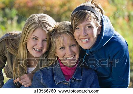 Portrait of mother with two teenage daughters View Large Photo Image Stock Image - Portrait of mother with two teenage daughters. Fotosearch