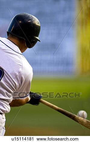 Rear view of a baseball player at bat View Large Photo Image Stock Image - Rear view of a baseball player at bat. Fotosearch